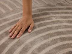 Detail of the Zen carpet's marked writing effect and its velvety, shiny pile