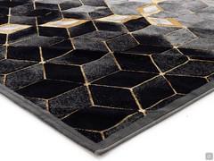 Detail of Gabrielle patterned rug in black and gold colors