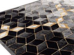 Detail of Gabrielle patterned rug in black and gold colors