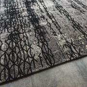 Mumbai has an abstract pattern with shades of black and dark and light grey. Bleached look perfect for urban livings