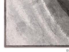 Detail of the lightest corner of the carpet in shades of silver-gray