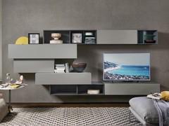 Wall unit equipped with open compartments with internal dividers. Perfect for giving harmony to the composition