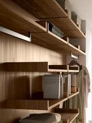 Detail of Wide shelf with backrest in natural walnut melamine. Hanging tubes can be purchased in the product card "Wide Hanging Interior Equipment".