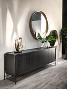 Shanghai sideboard in black ash wood with wrought iron feet in a patinated bronze finish