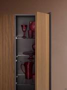 Refined matte lacquer interior with glass shelves. Good storage capacity and great attention to detail