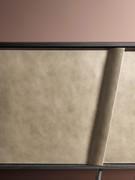 Sideboard Connie, detail of the sloping door in brushed nickel lacquer finish.