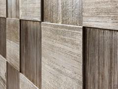 Detail of the doors in coated silver leaf carved larch wood