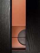 Detail of the circular metal handle of the inner drawers of the storage cabinet