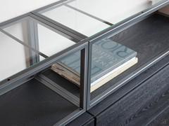 Open compartment with metal frame, bottom matching the base units and glass top