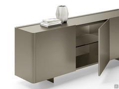 Detail of Maia modern sideboard with metal feet, top and doors in Titanium lacquer and inside shelves in smoked glass