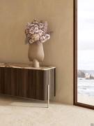 Detail of the Clivia sideboard in wood, with Patagonia marble top and embossed Sand metal leg