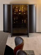 Daphne curved wooden buffet cabinet in a black oak blockboard finish with central glass door and Sahara Noir ceramic top