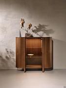 Dafne buffet cabinet with central glass door, here proposed with structure and top in American walnut 