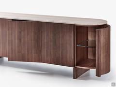 Side view of the Dafne sideboard in curved wood