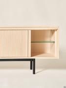 Katen internal compartments of the sideboard are always divided by a central clear glass shelf