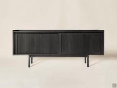 Katen low sideboard with ribbed fronts in black tinged solid wood