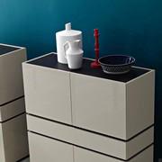 Raiki modern cupboard with doors and drawers, detail of the top in contrast with the structure