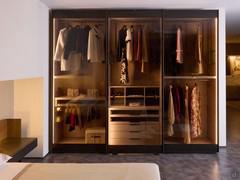 Boutique wardrobe with transparent glass sliding doors - the interior and fittings are in nude matte lacquer, an added bonus to the collection