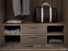 Close up of the top of the drawers, with leather top, matching cubby storage, and central emptying compartment