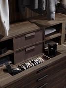 Elegant arrangement of cubby storage above drawer and storage compartment-emptying tray