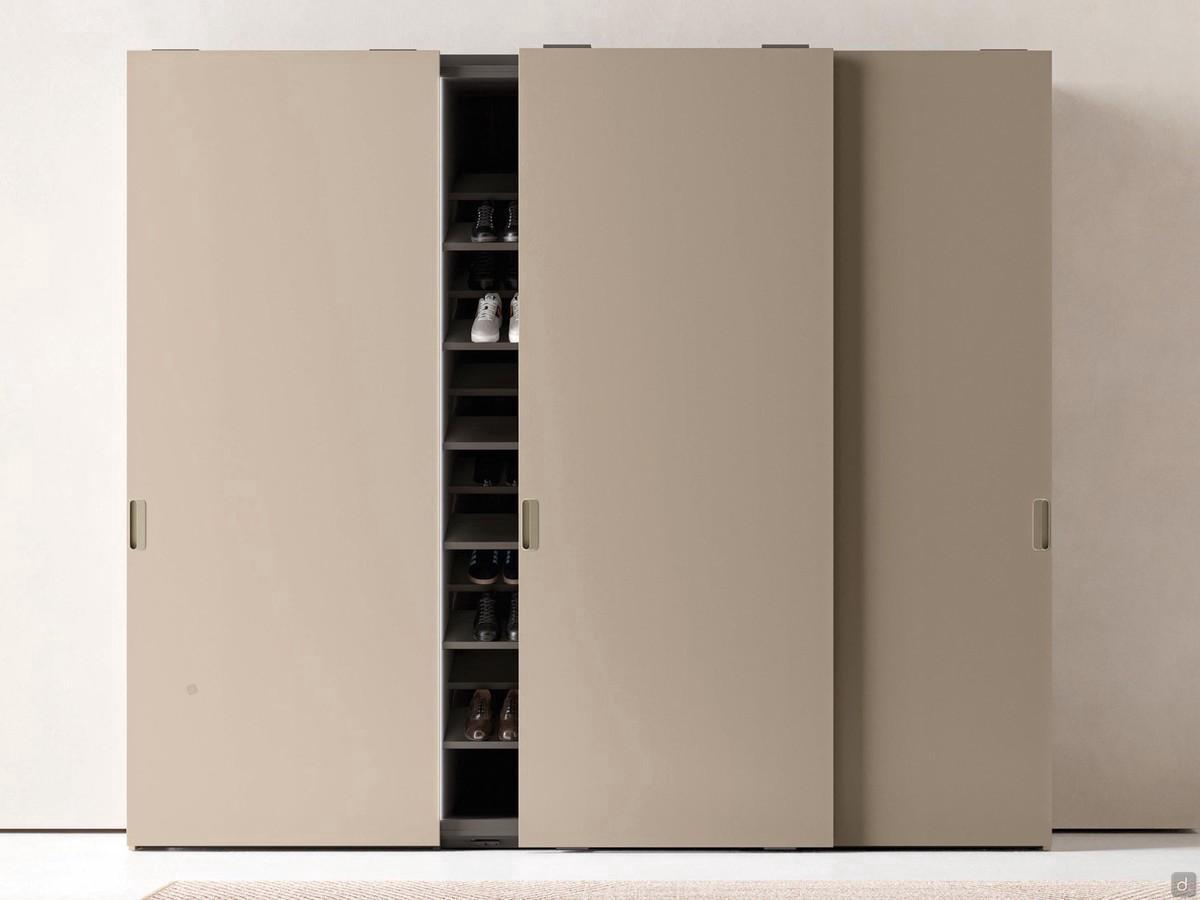 Focus Wide shallow depth sliding closet equipped entirely as a shoe rack, with the dedicated inclined shelves