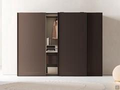 Mud matte lacquered closet equipped with matching hanging drawers and nude matte lacquered skin effect melamine interior.