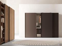 Midley Wide 3-door sliding wardrobes in the version with full-height profile handle painted mocha shine: bottom composition with matt lacquered doors mud, side composition with doors and interior in natural walnut veneer