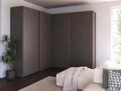 The Wide sliding corner wardrobe all matt lacquered mud: the Midley grooves keep the shapes and volumes of the wardrobe 'clean'