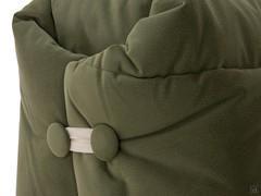 Detail of the buttons and laces closing the upper hood of the sofa bed