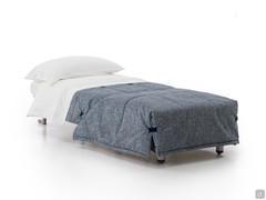 Derby armchair bed transformed into a single bed with integrated blanket