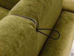 Detail of the small cord to rotate the backrest: wen the sofa bed is closed the cord is hidden between the two cushions