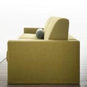 Lateral view of Carson sofa bed in a light but particular and cheerful colour