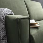 Detail of the trapezoidal shaped sofa bed's arms with pinched border