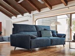 Brera sofa bed with high metal feet and the Block single-piece seat, upholstered in blue fabric