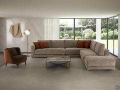 Clive sofa with down cushions in the corner version, with contrasting decorative cushions