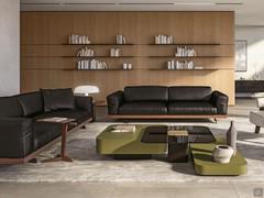 Classically elegant living room with pair of Raymond leather sofas with wooden base