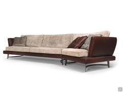 Roger sofa characterised by great formal lightness, high off the ground on shaped metal feet