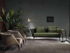 Living room composed entirely of Lovy products by Bonaldo: sofa with low backrest and armchairs