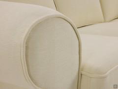 Levante classic fabric sofa with flounces, detail of the round armrest with matching piping