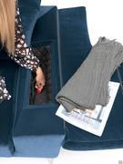 The armrests conceal a practical quilted storage compartment, perfect for storing items, books or magazines