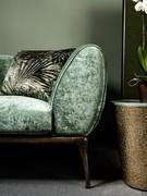 Detail of the armrest in dark green Bellagio velvet and frame in patinated bronze