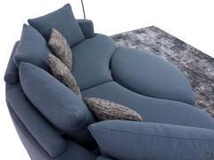 Detail of Messico sofa with oval ottoman, the ottoman can be aligned with the rest of the sofa to form a sort of big "isle" 