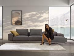 Frontal view of the modular sofa by Biarritz: please note the "floating effect" given by the generous cushions standing on a very thin platform with metal feet