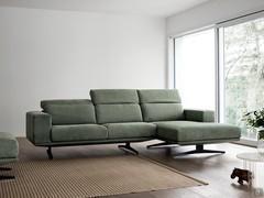 Modern sofa with chaise longue and adjustable headrests Burton high off the ground thanks to designer feet