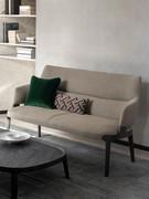 Sofa with high solid wood feet Velis, upholstered in fabric