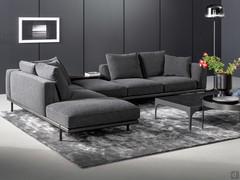 Sofa with integrated bookcase Phil by Bonaldo in a prominent corner composition, with open elements and the optional leather coffee table