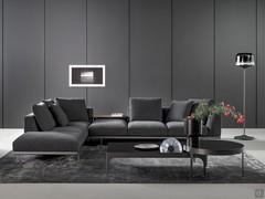 Sofa Phil by Bonaldo in one of the many possible corner compositions. This particular version, dynamic and original, leaves a backless seat, complementing it with a leather coffee table