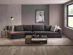 Holiday modern sofa with an inclined peninsula, in the version with backrest cushions, upholstered in dark grey fabric