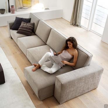 Attitude is a sofa with pull-out seat that becomes a chaise longue