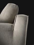 Detail of the rear backrest joined to the armrest and finished with the same webbing profile